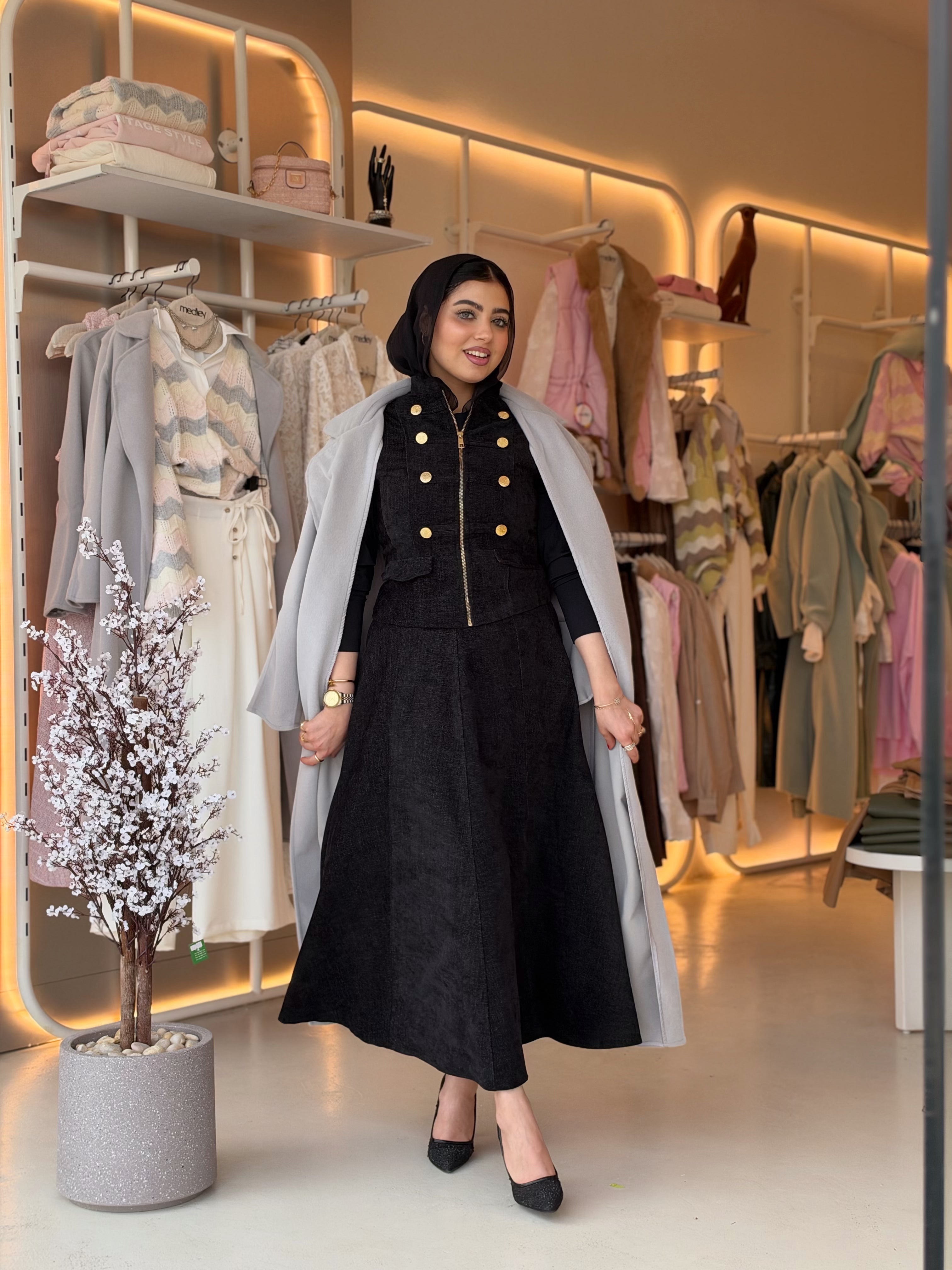 Elegant Wool Long Coat in gray by Medley Fashion, worn open over a black dress
